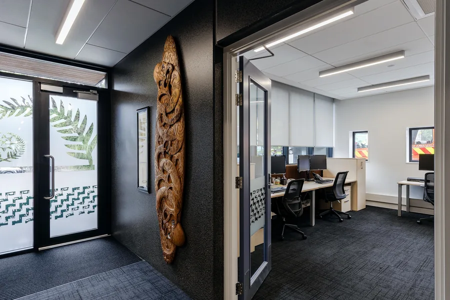 Workstations and a carved panel inside the Parnell fire station fit out